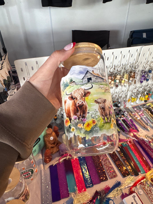 Highland cows with barn clear glass
